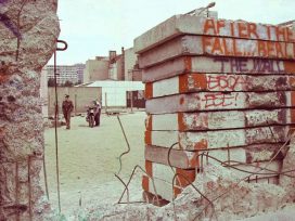 Peekaboo through holes of the Berlin wall